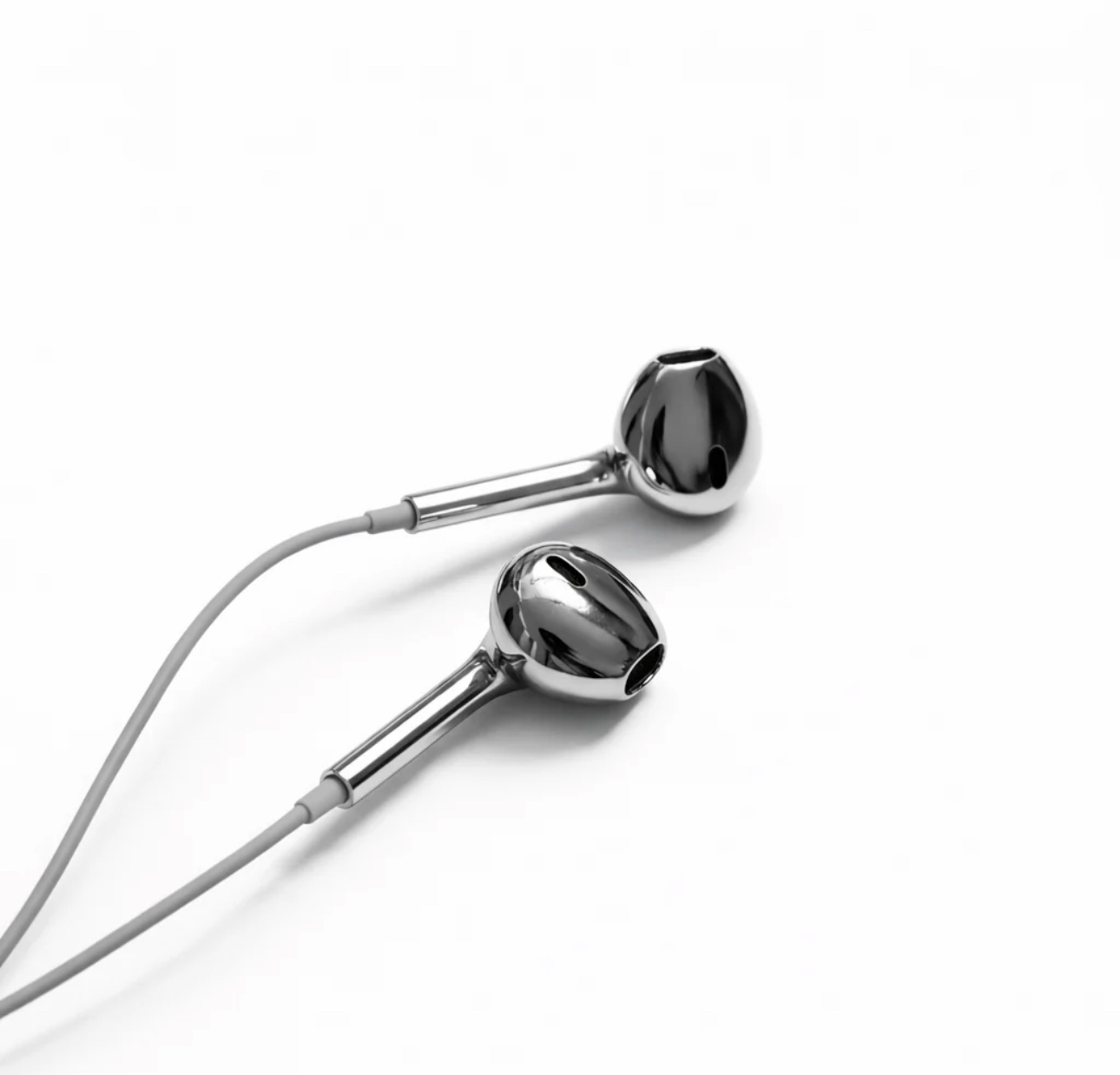 Angled view of GHROMA chrome wired earphones with cables